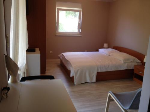 Łóżko lub łóżka w pokoju w obiekcie Apartman Hlanuda