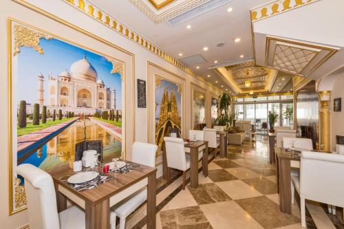 a restaurant with a mural of the taj mahal at Harmony Hotel Merter & SPA in Istanbul