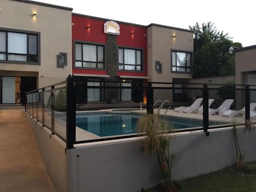 a house with a swimming pool in front of it at JAK Colón in Colón