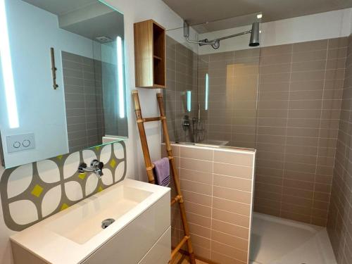 a bathroom with a sink and a shower at The Secret Lakeside in Gravedona