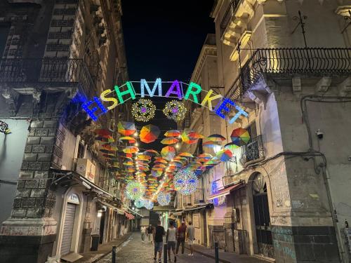 a street with a sign that says happy new year at Gloria Suite Catania in Catania