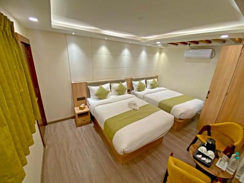 a bedroom with two beds in a room at Shine Boutique Hotel in Kathmandu