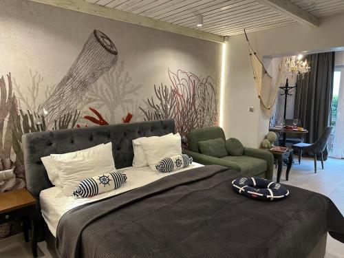 a bedroom with a large bed with a painting on the wall at NOBILTON Dębki in Dębki