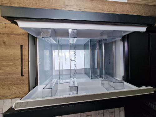 a glass display case in a room with at VILLA CALA LLARGA BEACH in Roses
