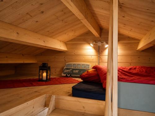 a room with two beds in a wooden cabin at Finca Mariposa Mariposaholidays in Nerja
