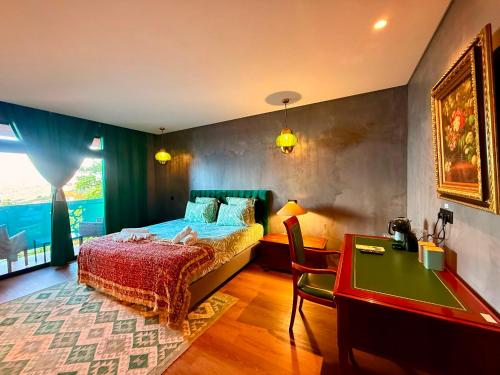 a bedroom with a bed and a pool table at Al Dazk in Ribeira Brava