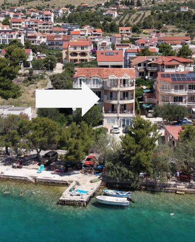 a view of a city with boats in the water at Open Sea Apartmani in Grebaštica