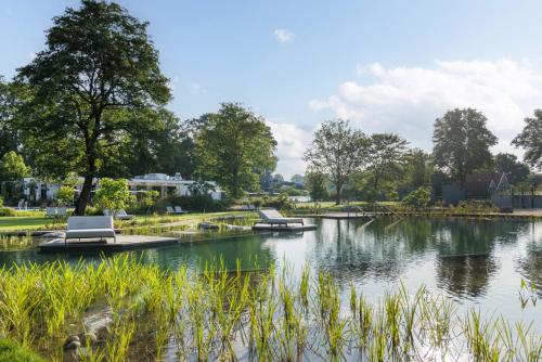 a view of a lake in a park at Glamping Winterswijk in Miste
