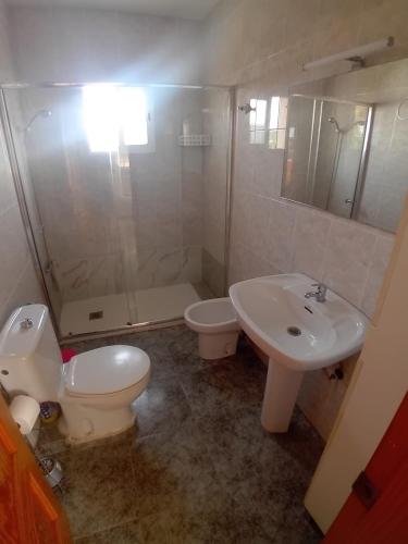 a bathroom with a toilet and a sink and a shower at COSTACABANA Apartamento in Almería