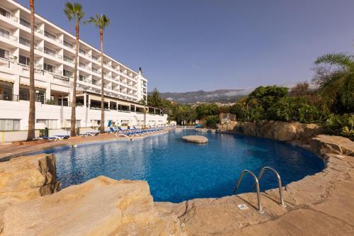 a large swimming pool in front of a hotel at BLUESEA Costa Jardin & Spa in Puerto de la Cruz