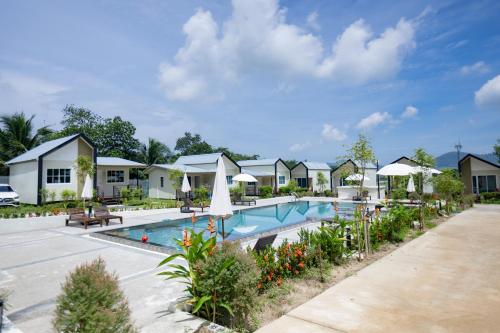 a swimming pool at a resort at NaraRin Phuket Resorts in Thalang