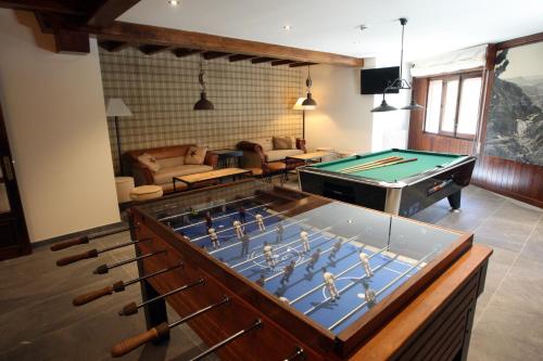 a living room with a pool table and ping pong ball at Hotel & Spa Real Villa Anayet in Canfranc-Estación