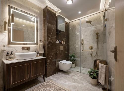a bathroom with a toilet and a sink and a shower at Hotel Skynex - Near Delhi Aerocity in New Delhi