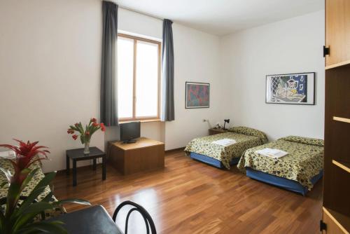Krevet ili kreveti u jedinici u okviru objekta Residence Villa Odescalchi