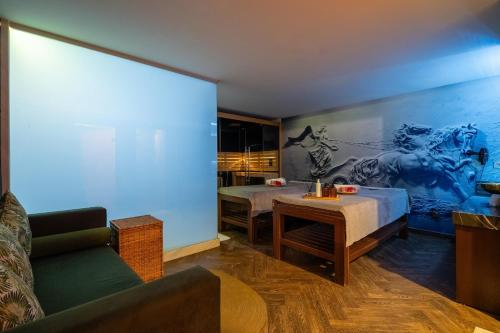 a living room with a large projection screen at Park Inn by Radisson Istanbul Asia Kavacik in Istanbul