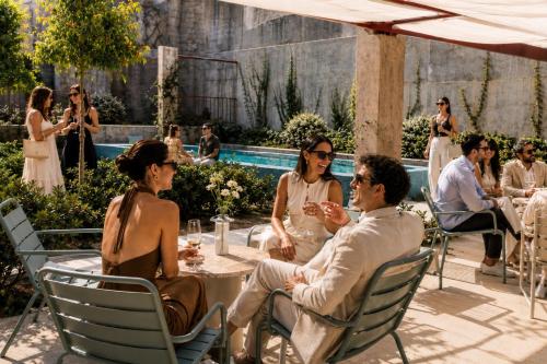 a group of people sitting around a table at Password to Madrid Casa de Campo in Madrid
