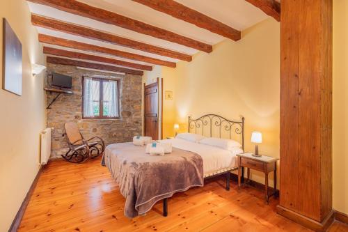 a bedroom with a bed in a room at Zelaikoa Behekoa - baskeyrentals in Zestoa