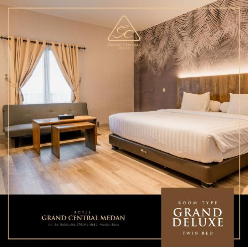 a poster of a bedroom with a bed and a table at Grand Central Medan in Medan