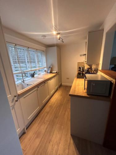 a kitchen with a sink and a counter top at The Forge in Avington