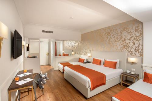 a hotel room with two beds and a desk at Hotel Shangri-La Roma by OMNIA hotels in Rome