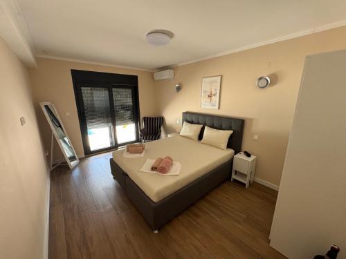 a bedroom with a bed with a purse on it at Villa Vento Mostar in Mostar