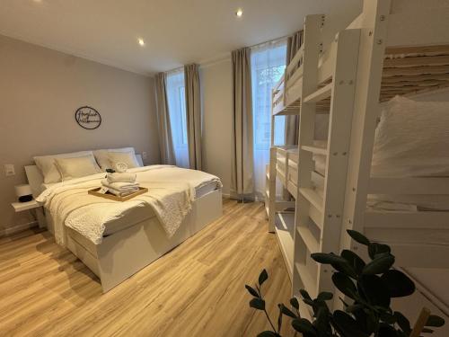 a bedroom with a bed and a book shelf at Zum Weinkrug - Apartments in Vienna