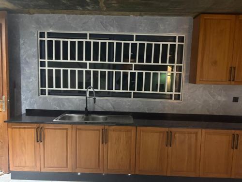 a kitchen with a sink and a window at Ponto de Ouro in Lopes