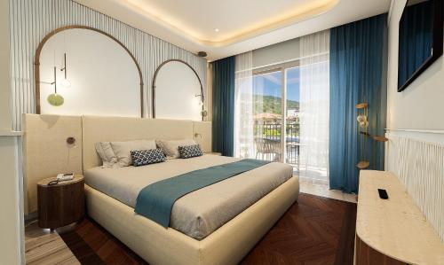 a bedroom with a bed and a large window at Grand Hotel Bristol in Stresa