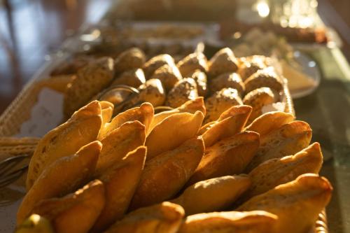 a tray of breads and pastries on a table at Hotel El Patio in Garachico