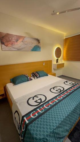 a bedroom with a bed with a comforter on it at Affar homes in Kumasi