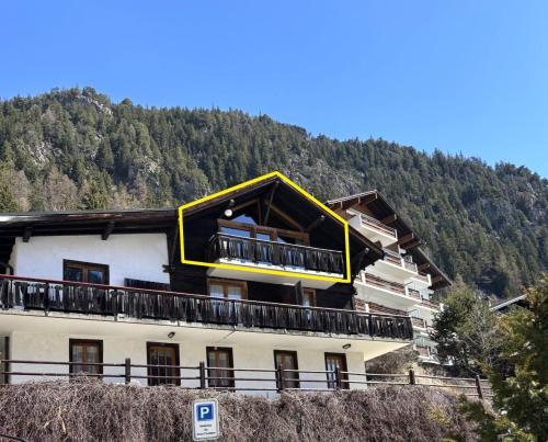a building with a large window on top of it at L'Attique du Vieux-Champex in Orsières