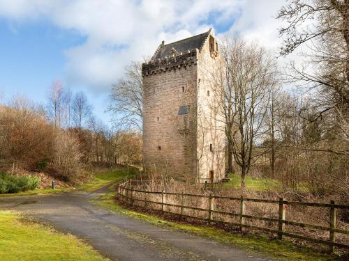 an old brick building on the side of a road at Braidwood Castle - Uk10672 in Braidwood