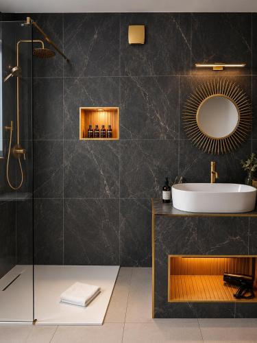 a bathroom with a sink and a mirror at The Véro Townhouse Killarney in Killarney