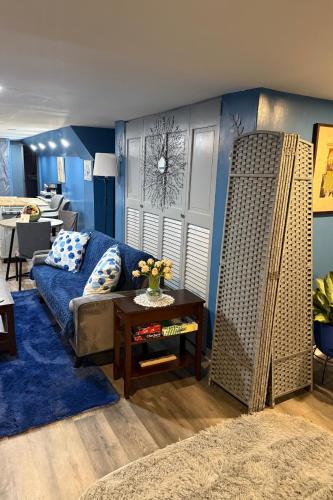 a living room with a couch and a table at Maxis-place in Jersey City