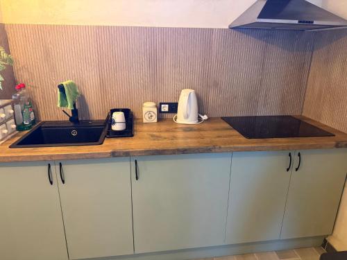 a kitchen counter top with a sink and a sink at El Tablado Ocean View House in Güimar