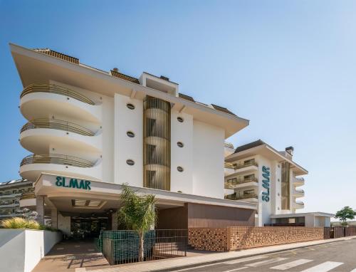 an apartment building with balconies on a street at ALEGRIA El Mar & Spa 4 SUP in Santa Susanna