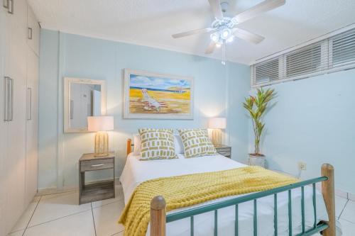 a bedroom with a bed and a ceiling fan at Breakers Resort 130 Umhlanga Beachfront in Durban
