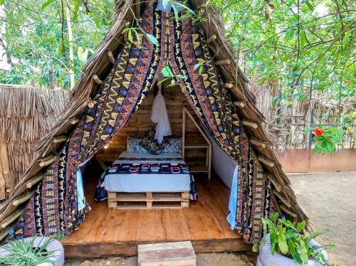 a room with a bed in a tent at Arusha Jua Eco Home- on coffee farm in Arusha