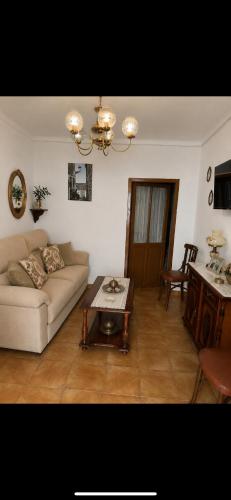 a living room with a couch and a table at Casa Abuela Dolores in Setenil