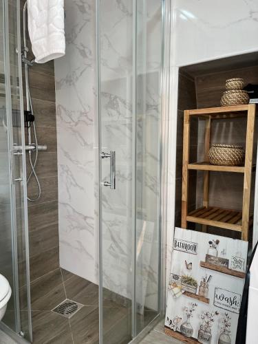 a shower with a glass door in a bathroom at R2R - Casa Gatu - 307A in Cudillero