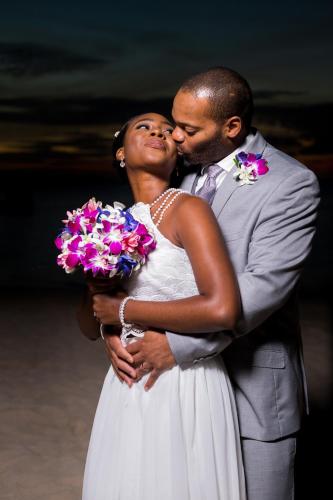 a bride and groom posing for a picture at Deja Resort All Inclusive in Montego Bay