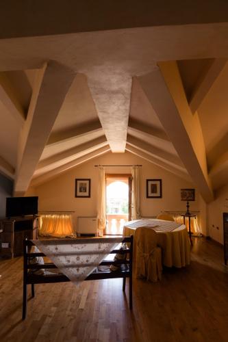 a large room with a table and a window at Villa Bongiovanni in San Bonifacio