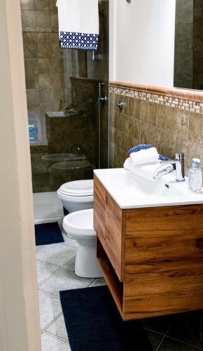 a bathroom with a sink and a toilet at B&B Don Nicola in Bonefro
