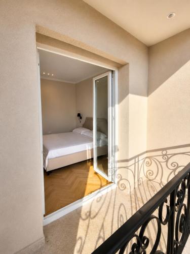a view of a bedroom from a balcony at Hotel Luxury Palace in Ishull-Lezhë