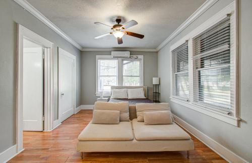 a living room with a couch and a bed at Cute Downtown Stay near Toyota Center & Midtown in Houston