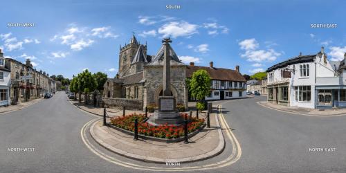 a rendering of a street in a small town at George Inn, Mere in Mere