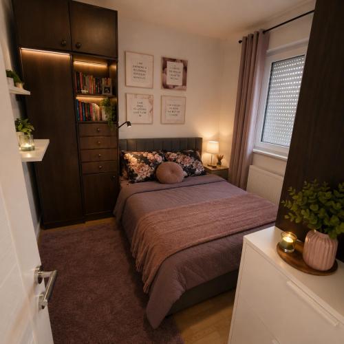 a bedroom with a bed and a book shelf at Garden lux 1 in Belgrade