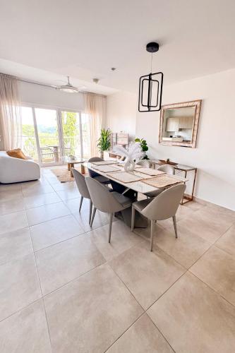 a dining room with a table and chairs at PH Palash Tower in Rousseau