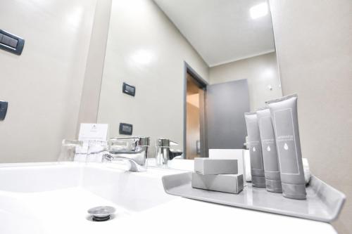 a bathroom with a sink and a mirror at Fiesta Royale Hotel in Accra