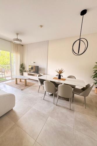 a dining room with a table and chairs at PH Palash Tower in Rousseau